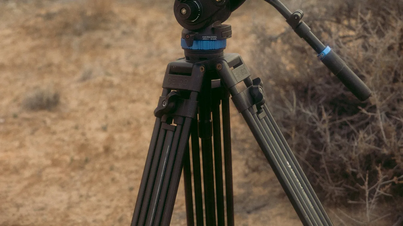 a tripod with a camera on it in the desert