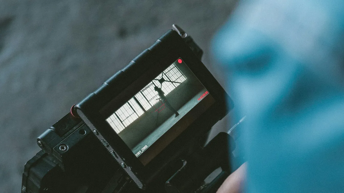 a person is holding a video camera