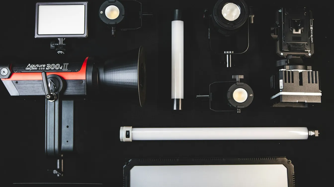 a variety of lighting equipment on a black background