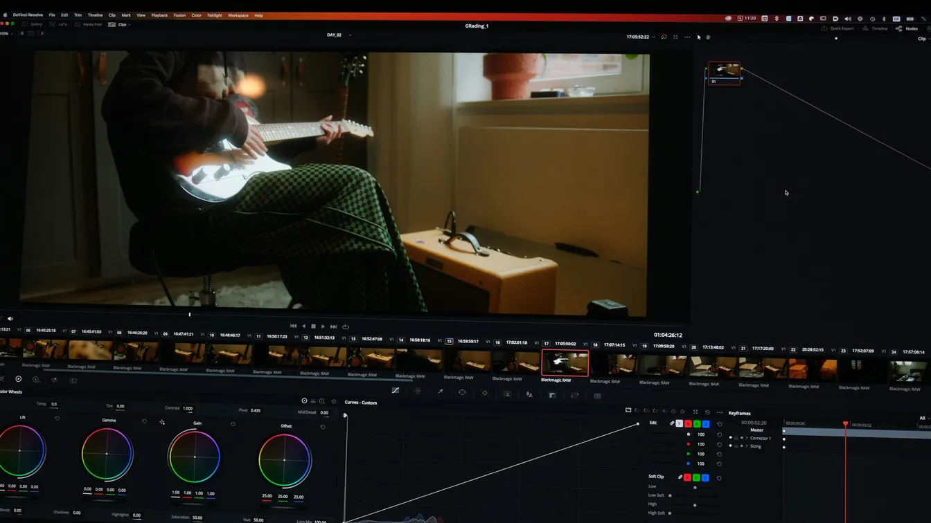 a video editing screen showing a man playing a guitar