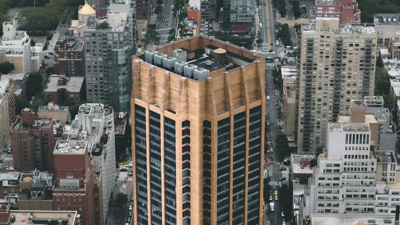 an aerial view of a tall building in new york city