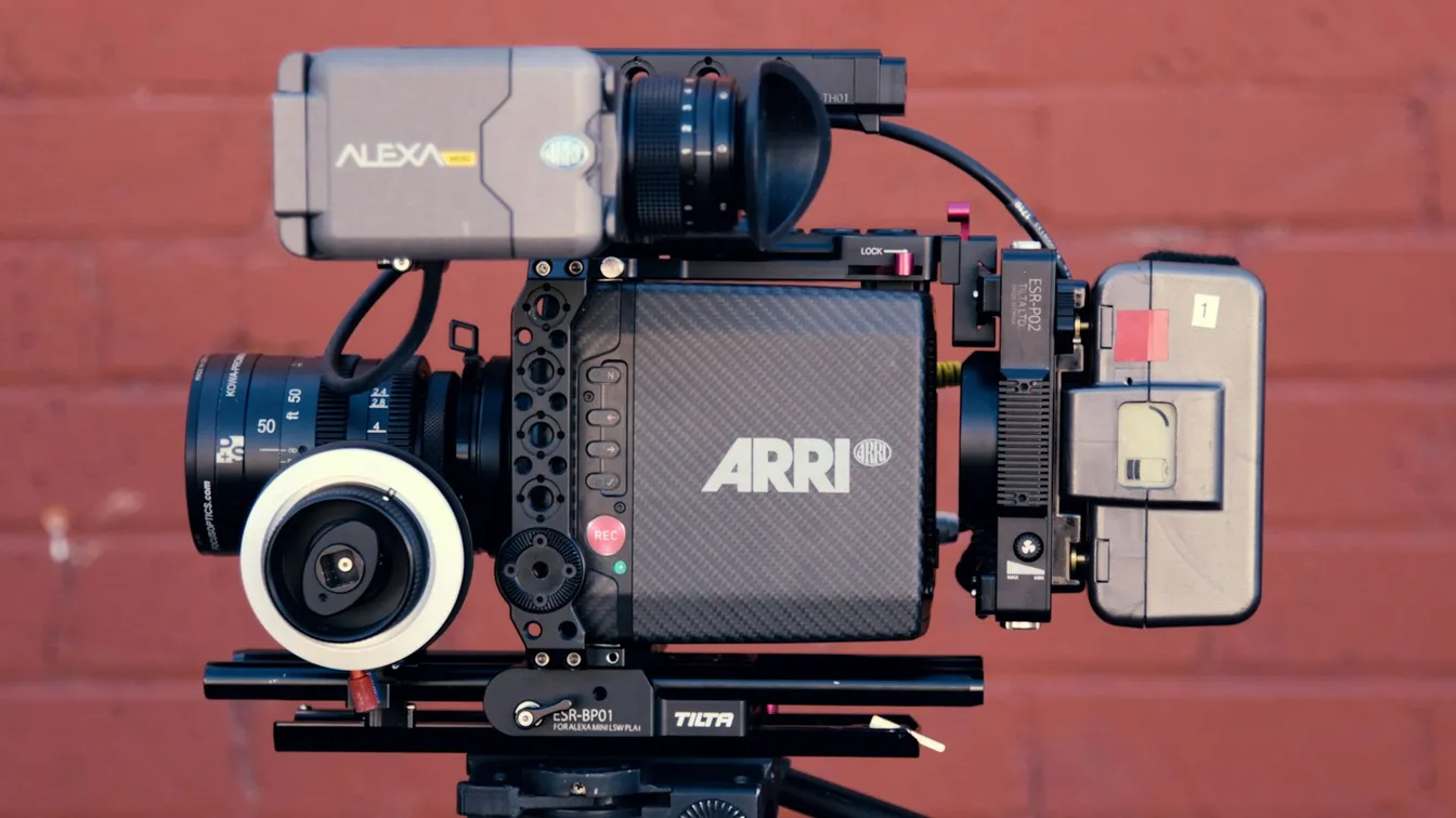 a camera on a tripod with a camera attached to it