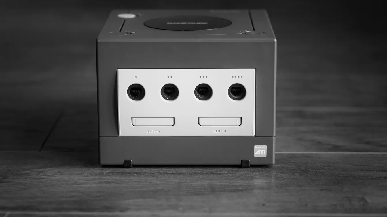a black and white photo of a nintendo game console